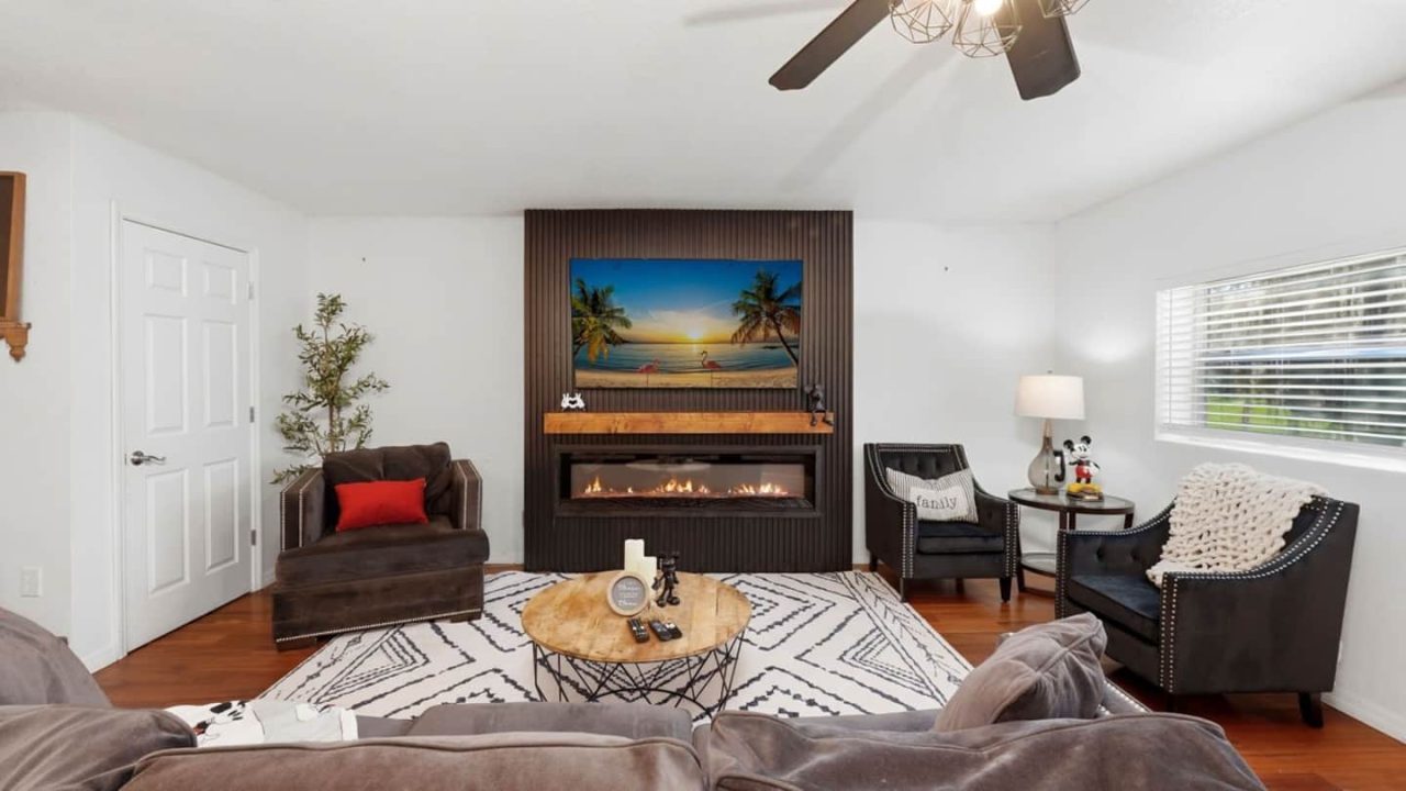 Living room with fireplace and TV