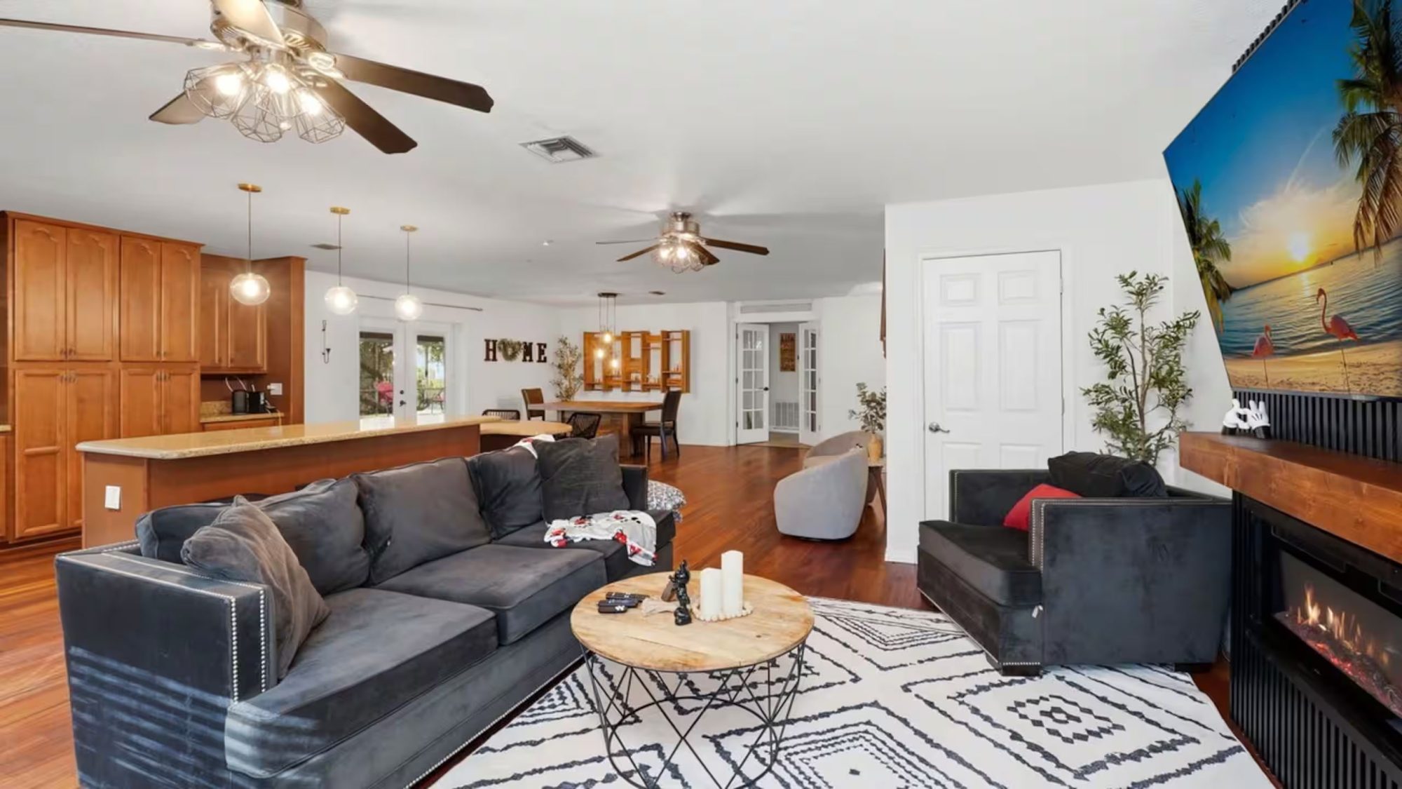 The open living area, fireplace, big couch, and room for everyone